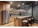 Stylish wet bar with wood cabinetry, marble countertop, mirrored backsplash, and pendant lighting at 1297 Swims Valley Nw Dr, Atlanta, GA 30327