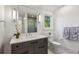 Elegant bathroom with marble countertop, modern fixtures, and ample natural light at 1297 Swims Valley Nw Dr, Atlanta, GA 30327