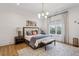 Serene bedroom with neutral tones, large window, and stylish furnishings at 1297 Swims Valley Nw Dr, Atlanta, GA 30327