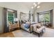 Primary bedroom featuring modern decor, natural light, and an ensuite bathroom at 1297 Swims Valley Nw Dr, Atlanta, GA 30327