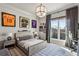 Bedroom featuring a unique light fixture, sports memorabilia and study area at 1297 Swims Valley Nw Dr, Atlanta, GA 30327
