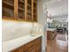 Butler pantry with wood cabinets and countertop with a sink that complements the kitchen's design at 1297 Swims Valley Nw Dr, Atlanta, GA 30327
