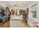 Spacious walk-in closet with custom shelving, drawers, and island for accessories at 1297 Swims Valley Nw Dr, Atlanta, GA 30327
