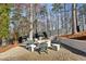A backyard firepit surrounded by Adirondack chairs offers a cozy outdoor gathering spot for relaxed evenings at 1297 Swims Valley Nw Dr, Atlanta, GA 30327