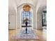 Grand foyer with a large window, modern light fixture, wood floors, and an elegant area rug at 1297 Swims Valley Nw Dr, Atlanta, GA 30327