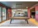 Game room featuring a pool table next to a gym with glass partitions and hardwood floors at 1297 Swims Valley Nw Dr, Atlanta, GA 30327