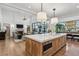Gourmet kitchen flows seamlessly to living area with a center island and high end appliances at 1297 Swims Valley Nw Dr, Atlanta, GA 30327