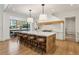 Open concept kitchen with a large center island, pendant lighting, and stainless steel appliances at 1297 Swims Valley Nw Dr, Atlanta, GA 30327