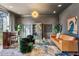 Well-appointed living room with a stylish bar, comfortable seating, unique decor, and ample natural light at 1297 Swims Valley Nw Dr, Atlanta, GA 30327