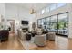 Bright living room features high ceilings, a fireplace, large windows, and hardwood floors at 1297 Swims Valley Nw Dr, Atlanta, GA 30327