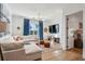 Cozy living room with hardwood floors, comfortable seating, and bright windows at 1297 Swims Valley Nw Dr, Atlanta, GA 30327