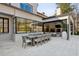 Spacious patio area with a dining table, seating, and access to a covered outdoor living space, perfect for entertaining at 1297 Swims Valley Nw Dr, Atlanta, GA 30327