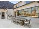 Elegant outdoor dining area with a large table and seating, next to a built-in grill, perfect for entertaining at 1297 Swims Valley Nw Dr, Atlanta, GA 30327