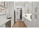 Pantry with stainless steel appliances, white cabinets and countertops offering ample storage space at 1297 Swims Valley Nw Dr, Atlanta, GA 30327
