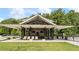 A covered poolside lounge has seating and ceiling fans at 1961 Haley Walk, Atlanta, GA 30318