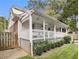 Charming back porch with string lights overlooking a well-maintained yard at 427 S Columbia Dr, Decatur, GA 30030