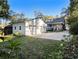 Spacious backyard with a two-car garage, mature trees, and a well-manicured lawn at 427 S Columbia Dr, Decatur, GA 30030