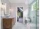 Serene bathroom featuring hexagon tile floor, walk in glass shower, and wood vanity at 427 S Columbia Dr, Decatur, GA 30030