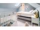 Charming bedroom with unique design elements, including a skylight and decorative railing at 427 S Columbia Dr, Decatur, GA 30030