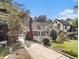 Charming brick home with stone accents, a cozy front porch, and a well-manicured lawn at 427 S Columbia Dr, Decatur, GA 30030