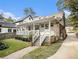 Charming house with a covered porch, landscaped front yard, and a brick pathway leading to the entrance at 427 S Columbia Dr, Decatur, GA 30030