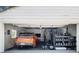 Well-organized garage featuring gym equipment, and a parked car, optimizing space for various activities at 427 S Columbia Dr, Decatur, GA 30030