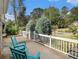 Charming front porch with chairs, a white railing, and a welcoming entrance to the home at 427 S Columbia Dr, Decatur, GA 30030