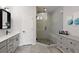 Modern bathroom with frameless shower, dual vanity, and linen storage at 6460 Cortland Walk, Alpharetta, GA 30005