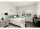 Bedroom featuring light paint, soft carpet, and plenty of natural light at 6460 Cortland Walk, Alpharetta, GA 30005