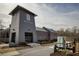 Exterior view of gray community building with Halcyon signage next to walking trail at 6460 Cortland Walk, Alpharetta, GA 30005