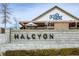Halcyon community entrance with brick signage and attractive landscaping around Ocean Acre at 6460 Cortland Walk, Alpharetta, GA 30005
