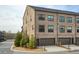 Attractive townhome condos with attached garages, manicured lawns and beautiful brick facade at 6460 Cortland Walk, Alpharetta, GA 30005