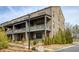 Beautiful brick townhome with covered front porches and professional landscaping at 6460 Cortland Walk, Alpharetta, GA 30005
