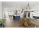 Open concept living area with kitchen island and adjacent dining area for seamless entertaining at 6460 Cortland Walk, Alpharetta, GA 30005