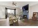 Open concept living room with fireplace, modern decor and balcony access at 6460 Cortland Walk, Alpharetta, GA 30005