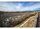 Scenic neighborhood view of boardwalk alongside protected wetlands and distant homes at 6460 Cortland Walk, Alpharetta, GA 30005