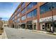 Commercial street view of stores and apartments with beautiful brick façade and sidewalks at 6460 Cortland Walk, Alpharetta, GA 30005