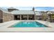 Community swimming pool with nearby outdoor covered social gathering area and lounge seating at 6460 Cortland Walk, Alpharetta, GA 30005