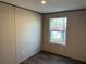 Bedroom features a window overlooking the backyard at 155 Emily Dr, Whitesburg, GA 30185