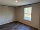 Bedroom features a window overlooking the backyard at 155 Emily Dr, Whitesburg, GA 30185