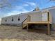Rear exterior of home with wood deck at 155 Emily Dr, Whitesburg, GA 30185