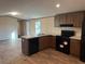 Kitchen with black appliances and island at 155 Emily Dr, Whitesburg, GA 30185