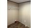 This laundry room features wood-look flooring and a wire shelf at 155 Emily Dr, Whitesburg, GA 30185