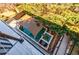 Aerial shot of a backyard pool and spa, shaded with a custom awning and surrounded by greenery at 1812 Hunters Gln, Marietta, GA 30062