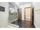 Contemporary bathroom with black honeycomb tile, glass shower, and floating vanity at 1812 Hunters Gln, Marietta, GA 30062