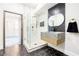 Modern bathroom featuring a sleek glass shower and a stylish floating vanity at 1812 Hunters Gln, Marietta, GA 30062