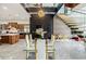 Bright dining area featuring modern table set, floating stairs, and contemporary lighting at 1812 Hunters Gln, Marietta, GA 30062