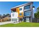 Stylish home featuring a mix of modern materials, a balcony, and a well-maintained lawn at 1812 Hunters Gln, Marietta, GA 30062