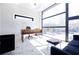 Bright home office with large windows, modern desk, and sitting area at 1812 Hunters Gln, Marietta, GA 30062