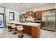 Modern kitchen featuring an island with stainless steel appliances and bar stool seating at 1812 Hunters Gln, Marietta, GA 30062